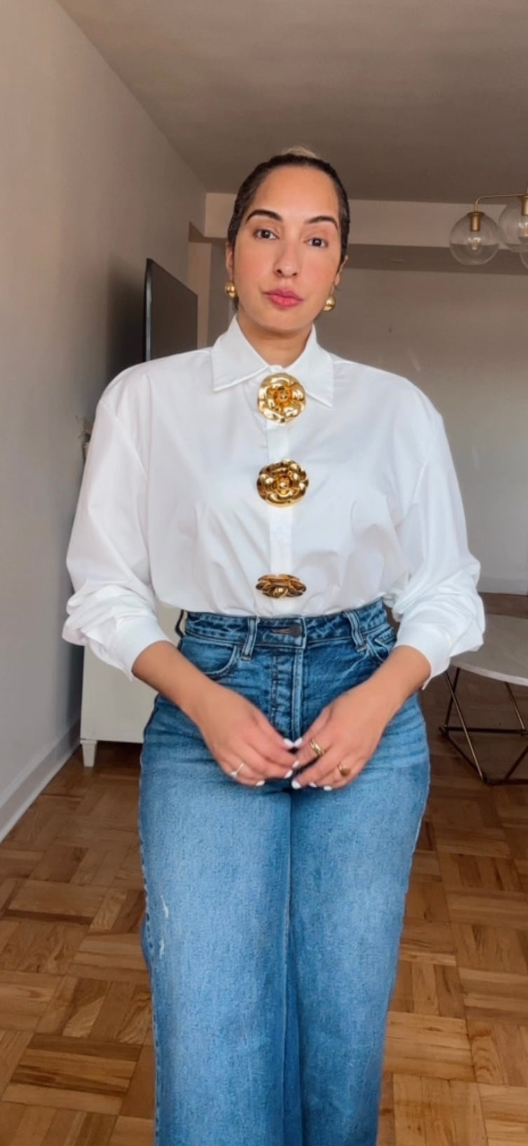 Gold buttons white top